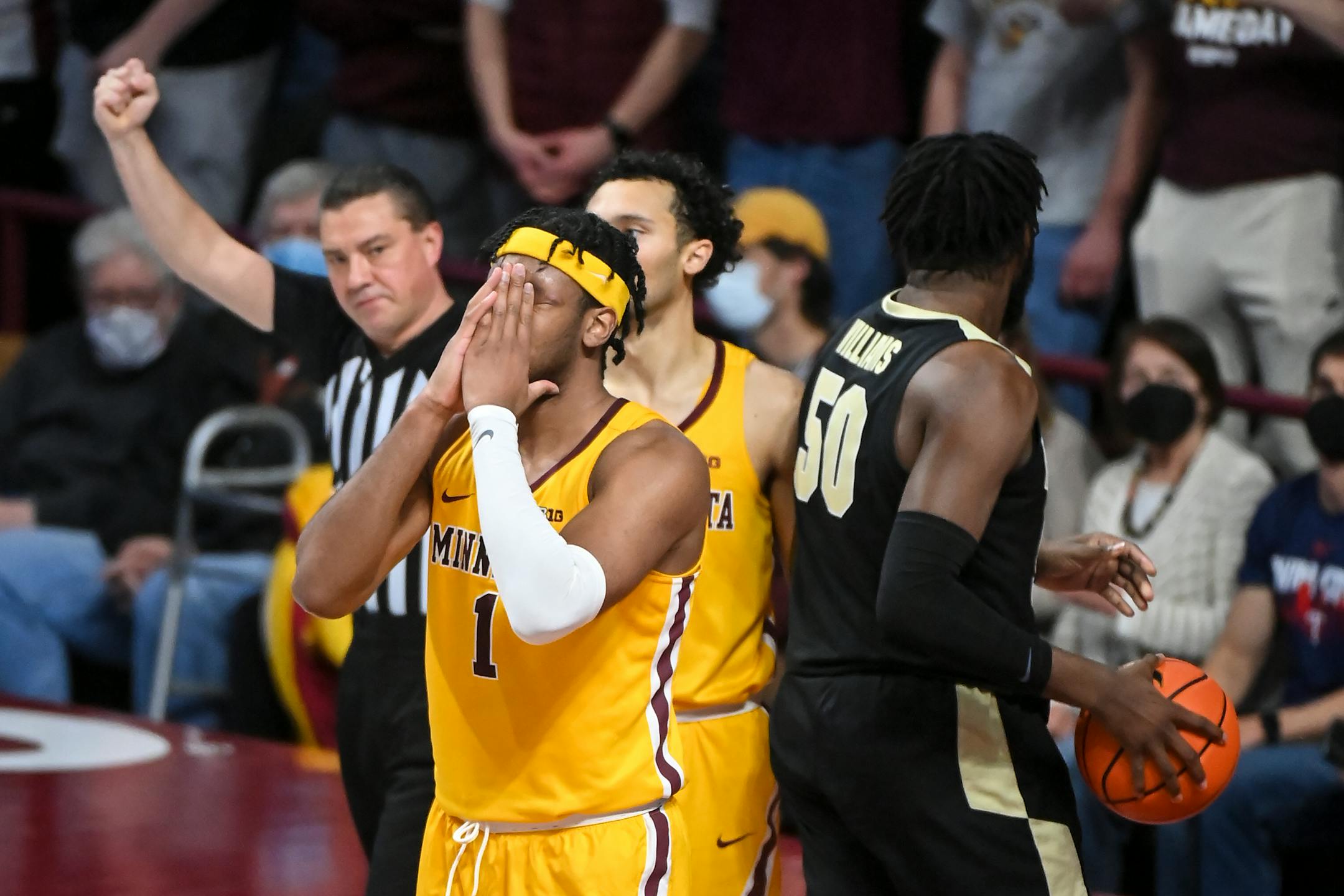 Minnesota Gophers forward Eric Curry (1) is upset after being called for his fourth personal foul during the second half of an NCAA men's basketball game between Minnesota and Purdue at Williams Arena in Minneapolis, Minn.