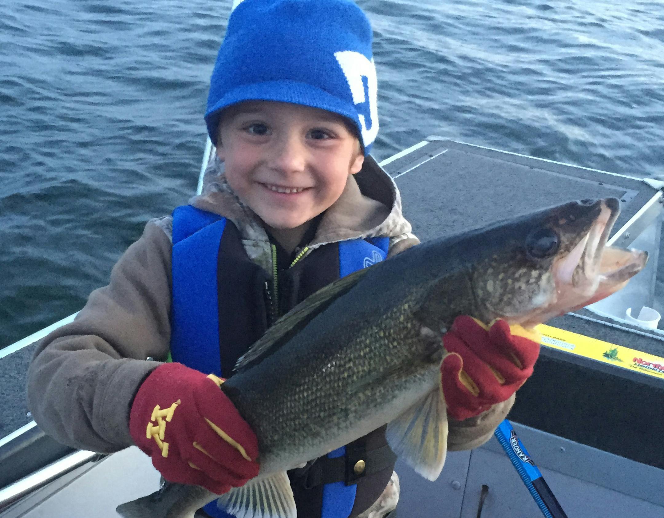 ONE AND HOOKED Kooper Groen, 6, of Elk River, caught and released this dandy 23Ω-inch walleye on Lake Mille Lacs. ìAfter reeling in several other smaller walleyeís, Kooper set the hook on his own on this one,íí said his dad, Joshua. ìAlthough the limit is only one fish on Mille Lacs, in this case all it took was one to get a kid hooked on fishing. This was not a ëslotí fish (that could be kept), but it was definitely one to be remembered.íí