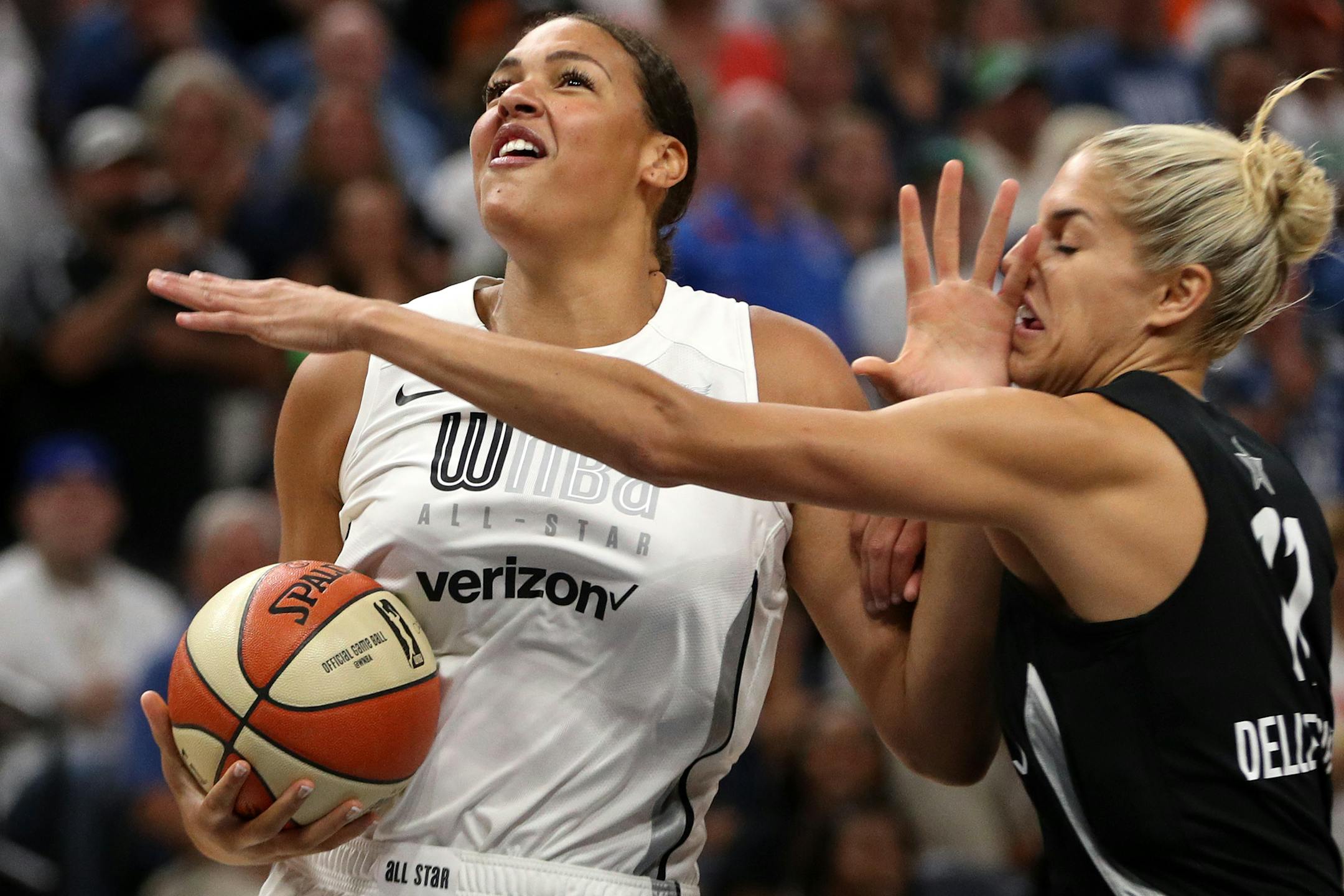 Team Parker center Liz Cambage (8) pushed off Team Delle Donne forward Elena Delle Donne (11) as she drove to the basket in the first half.