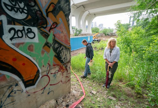 Jake Anderson's parents Bill and Kristi visited the site along the Mississippi River in Minneapolis, where Jacob's body was found. Bill climbed up an area below the 10th Street Bridge that had Jake's foot prints at the time of his death.