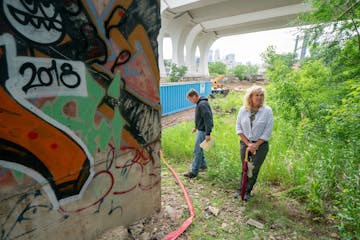 Jake Anderson's parents Bill and Kristi visited the site along the Mississippi River in Minneapolis, where Jacob's body was found. Bill climbed up an 