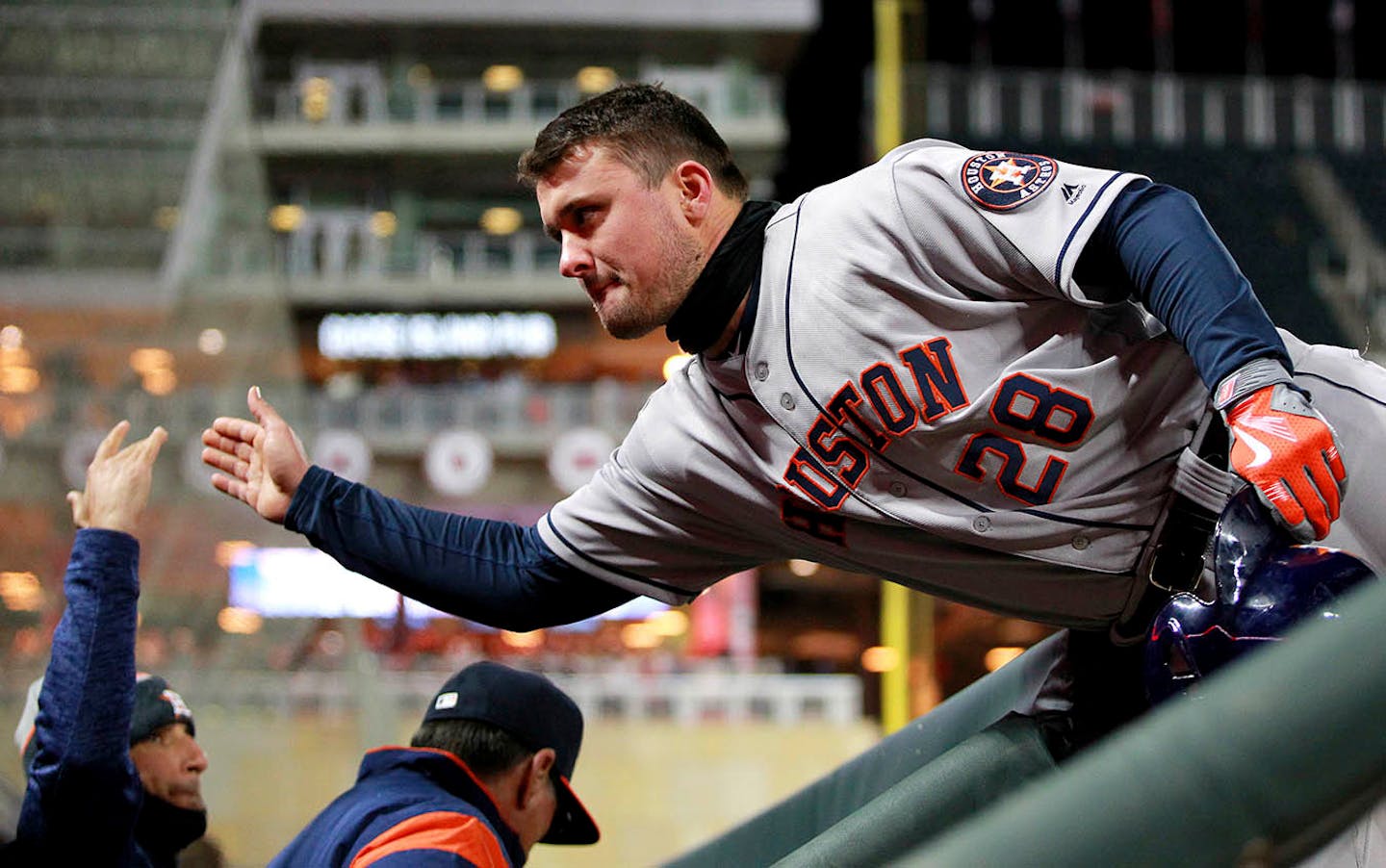 Houston Astros J.D. Davis (28) is congratulated by the dugout after hitting an RBI-single against the Minnesota Twins in the sixth inning of a baseball game Monday, April 9, 2018, in Minneapolis.