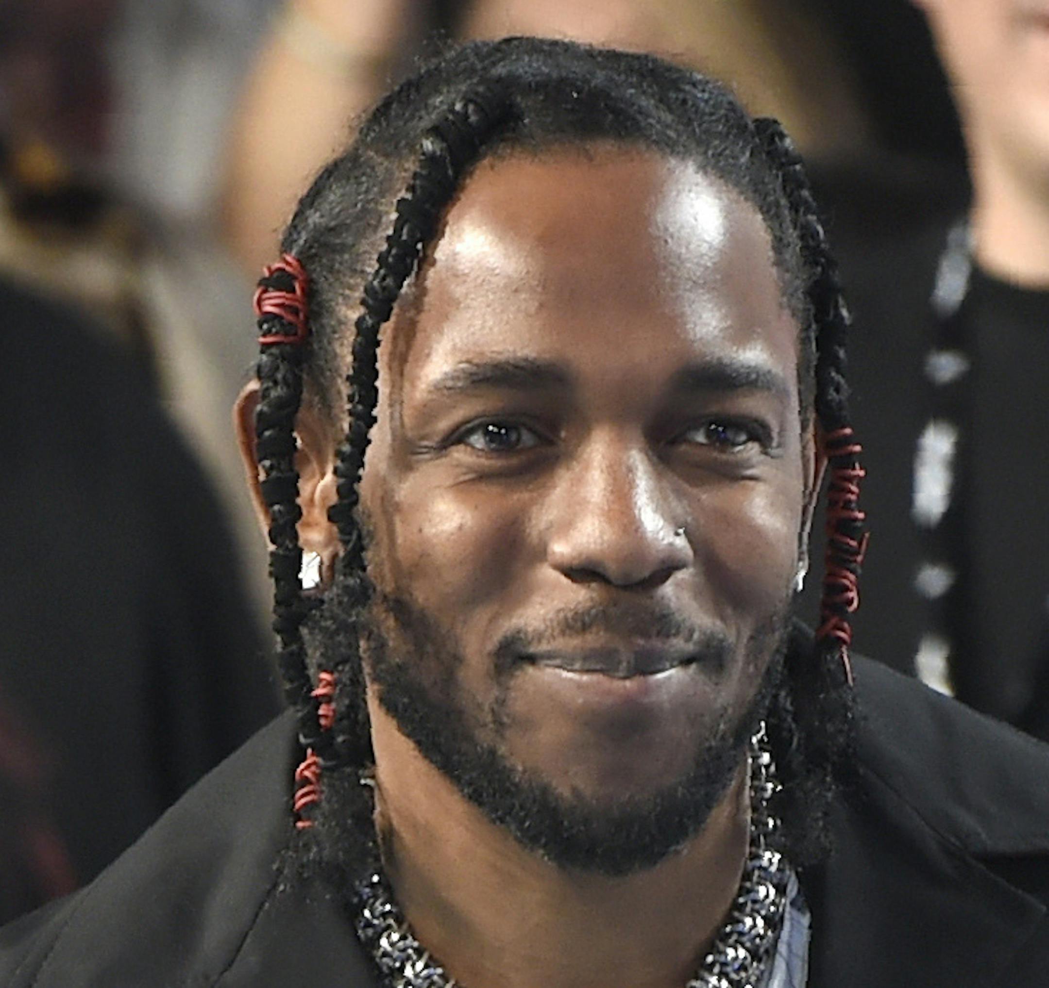 FILE - In this Aug. 27, 2017 file photo, Kendrick Lamar arrives at the MTV Video Music Awards in Inglewood, Calif. Lamar curated the release, "Black Panther The Album Music from and Inspired By," performed by various artists. (Photo by Chris Pizzello/Invision/AP, File)