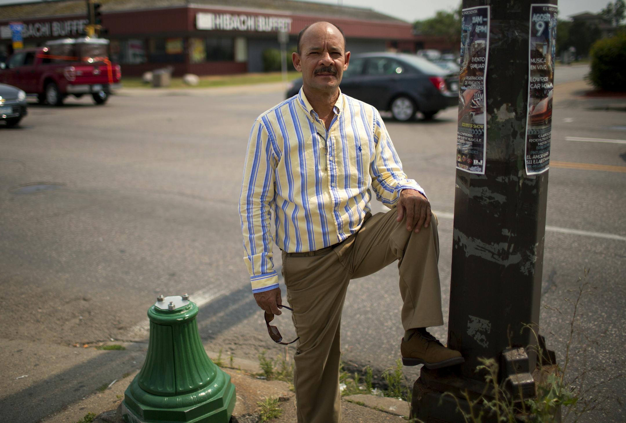 Roberto stands near the spot at Lake and Nicollette where he was hijacked at gunpoint and told to drive, a few blocks away he was shot at ( Missed!) when he would not hand over his wallet. ] BRIAN PETERSON ‚Ä¢ brian.peterson@startribune.com Minneapolis, MN 08/01/14 ORG XMIT: MIN1408040905532065