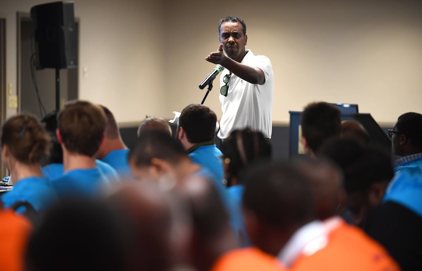 Ward 6 city councilman Abdi Warsame spoke in support of taxi drivers, many of of which come from his community, during a MAC public hearing Wednesday night. ] (AARON LAVINSKY/STAR TRIBUNE) aaron.lavinsky@startribune.com In response to the explosion of transportation options to ferry airport passengers, such as Uber and Lyft, the Metropolitan Airports Commission is considering a big change in the way it regulates taxicabs. The change would reduce a $3,350 one-time fee to $100 now charged to cabbi