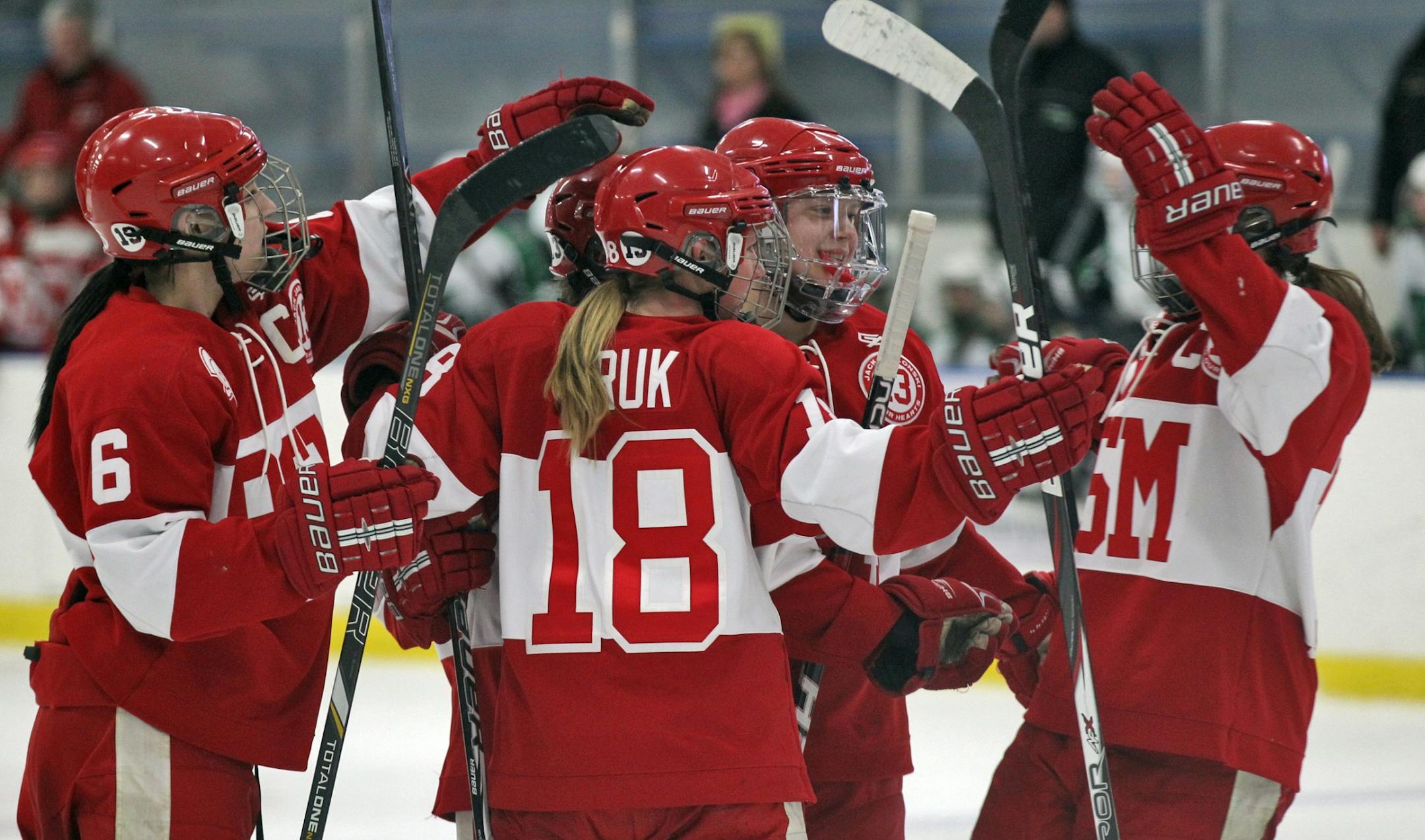 Benilde players celebrated a 3rd period goal by Brittany Wheeler.