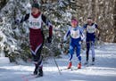 Margo Nightingale from Mounds Park Academy in St. Paul prepared to pass Greta Hansen from Math &amp; Science Academy during the classic Nordic ski rac