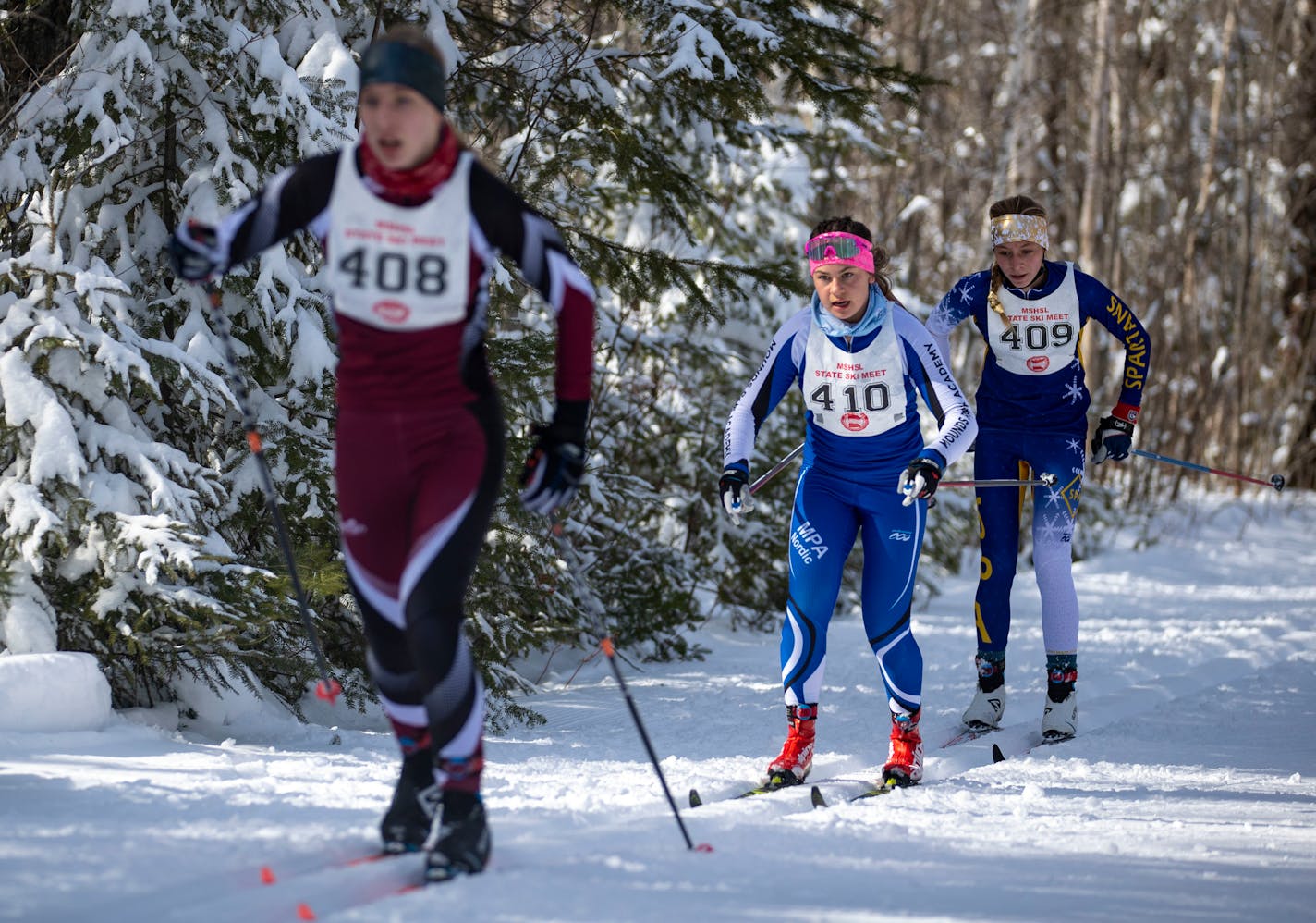 Margo Nightingale from Mounds Park Academy in St. Paul prepared to pass Greta Hansen from Math &amp; Science Academy during the classic Nordic ski race during the MSHSL Girls Nordic Skiing State Championship on Thursday. ]