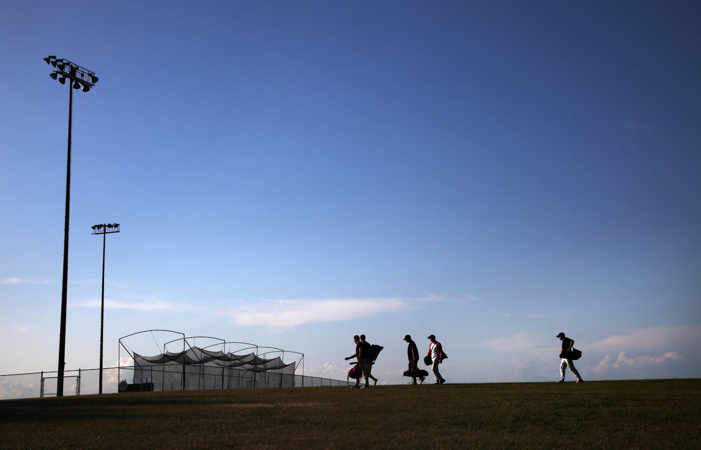 BRIAN PETERSON ¥ brianp@startribune.com Union Hill, MN 7/23/2009 ] Players walk to the field at Union Hill before the Union Hill -vs- Prior Lake Game.