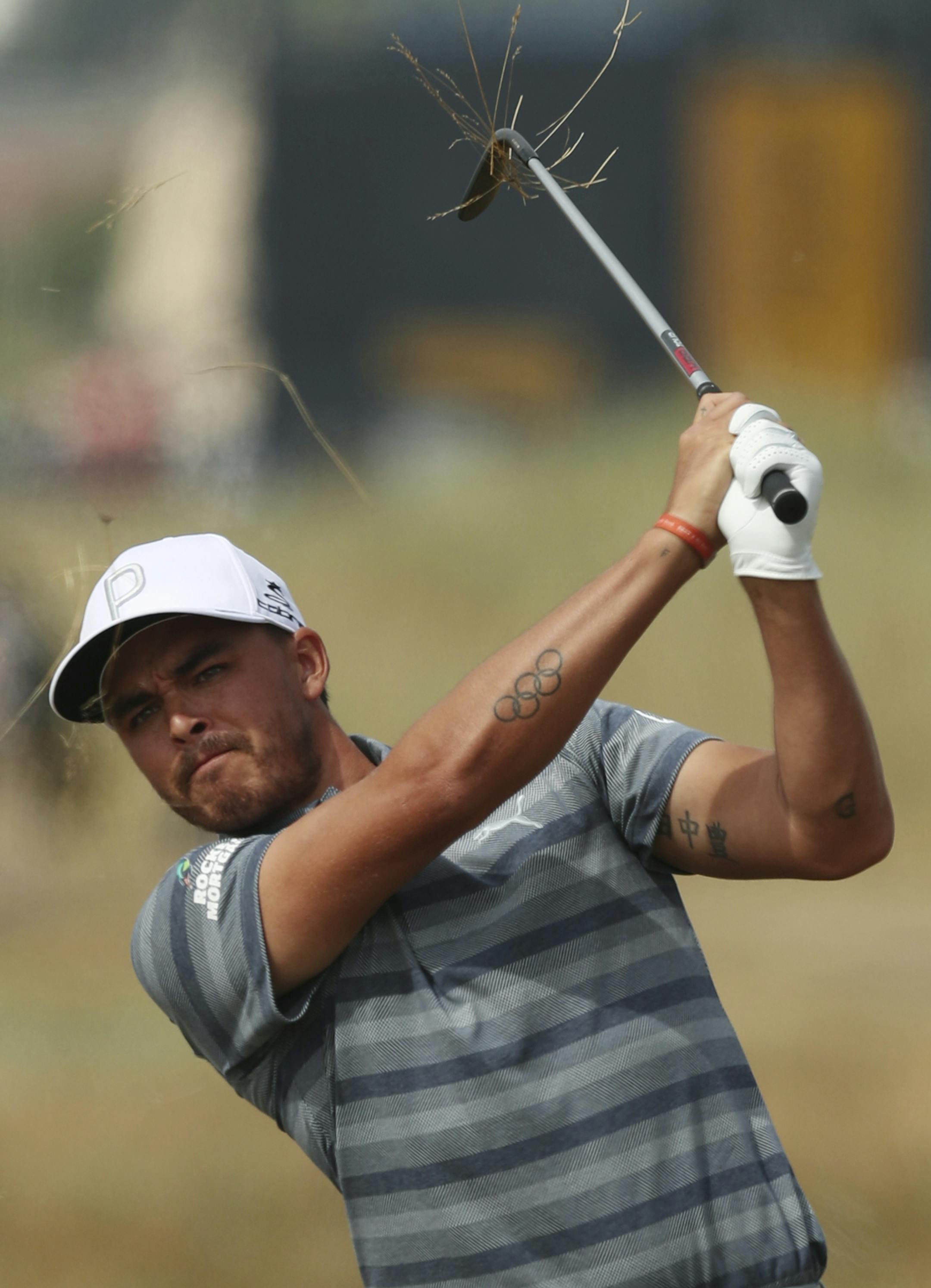 Rickie Fowler of the US plays out of the rough on the 2nd hole during the third round of the British Open Golf Championship in Carnoustie, Scotland, Saturday July 21, 2018. (AP Photo/Jon Super)
