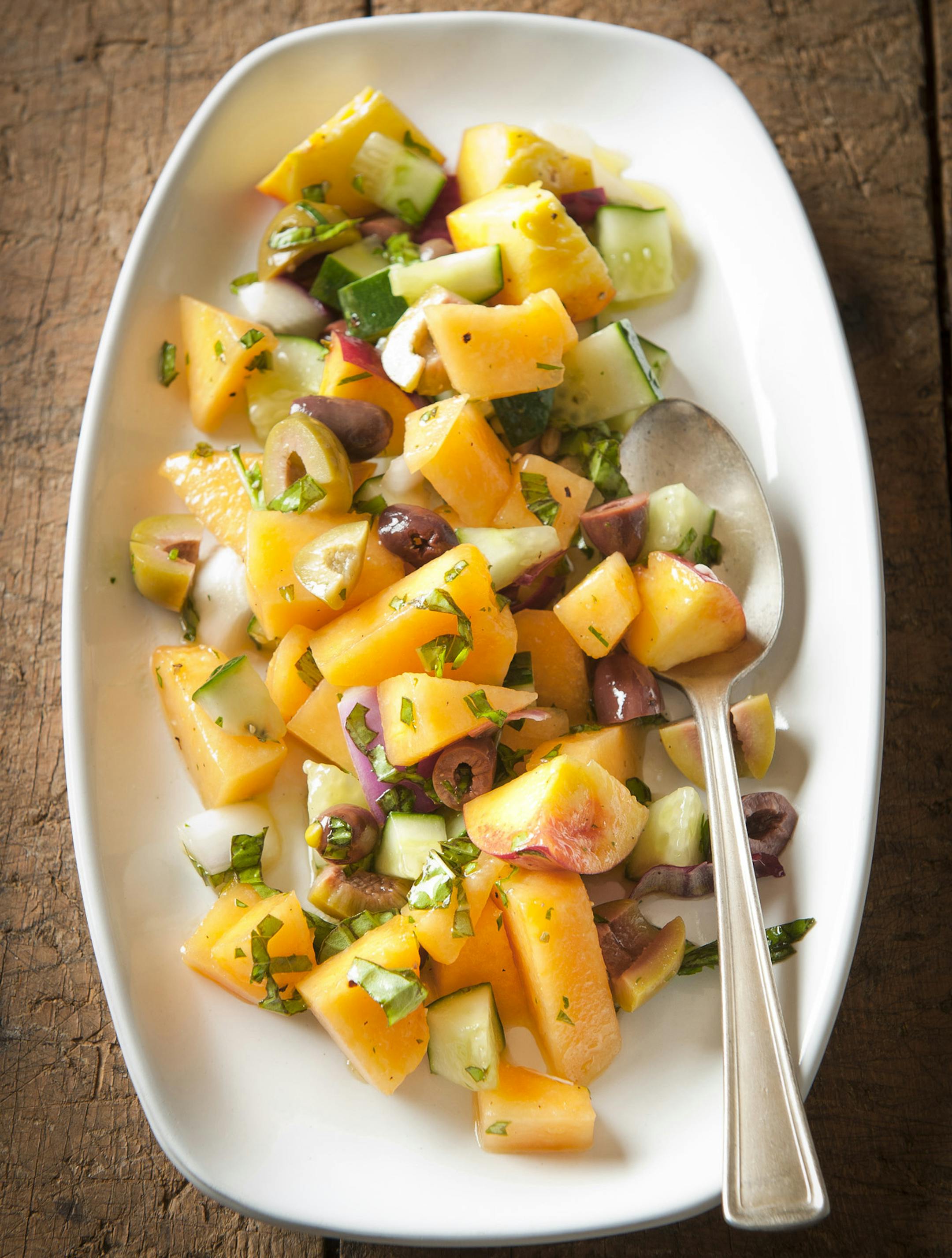Melon Cucumber and Olive Salad With Lemon Basil Vinaigrette.