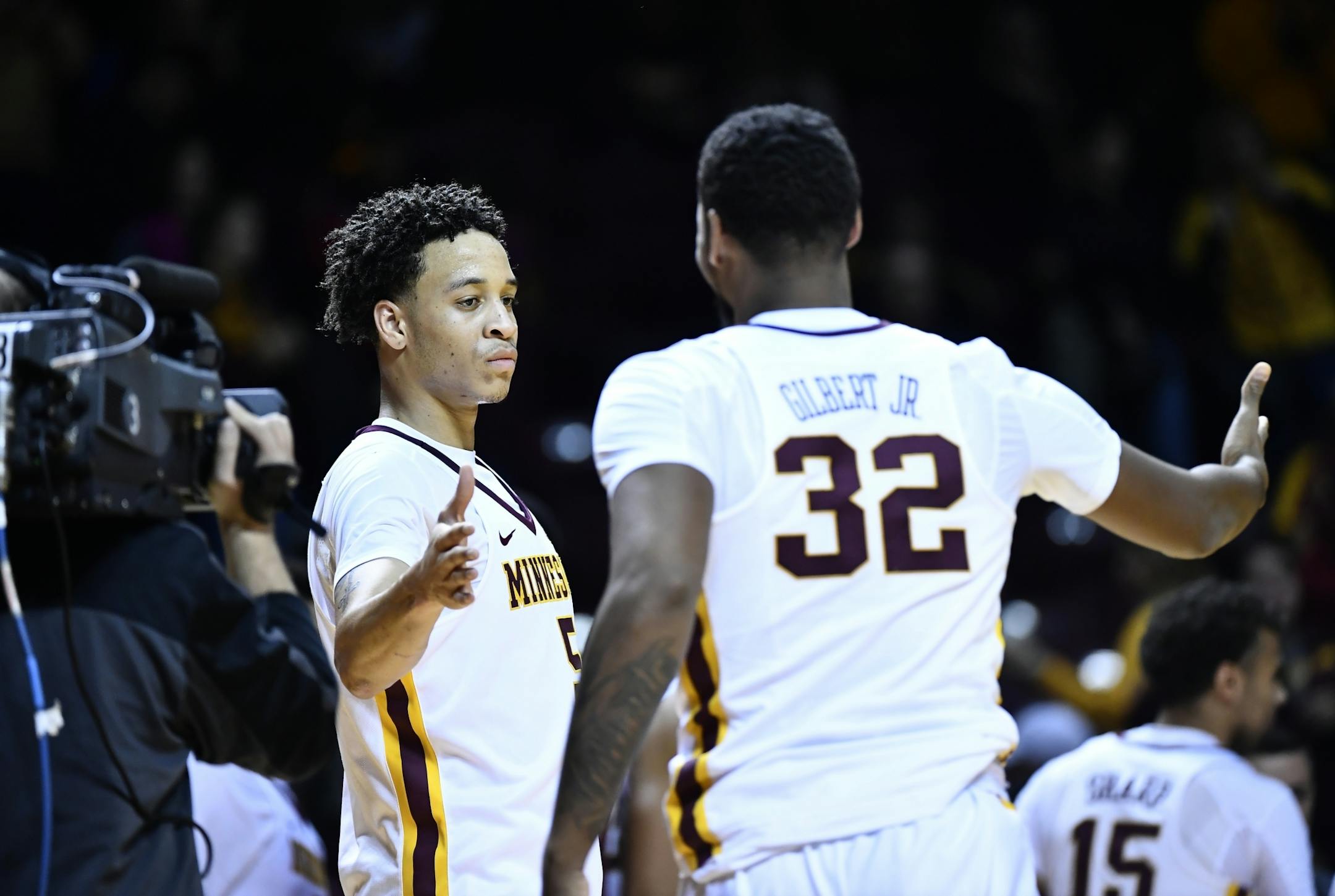 Gophers guard Amir Coffey, left, and guard Ahmad Gilbert
