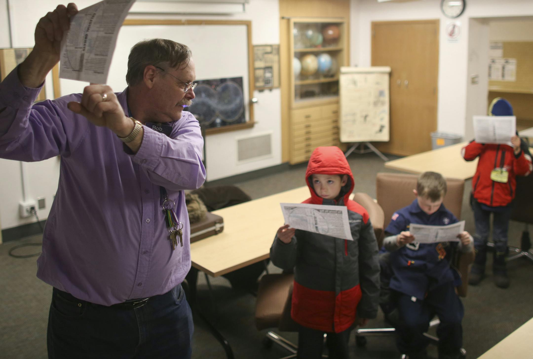 Volunteer Bob Shaw showed a group of Cub Scouts how to read a chart of the night sky during a program he presented in the Eisenhower Observatory Thursday night. The two boys are Jace George and Connor Ryan, right, both 8. ] JEFF WHEELER ï jeff.wheeler@startribune.com The Eisenhower Observatory in Hopkins doesn't have much to see any more, because the night sky has all but disappeared. The city has tried to do something about the main culprit, light pollution, but it can't do much about the