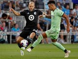 After coming off the bench, Teemu Pukki, left, battled with Austin FC defender Julio Cascante in Pukki’s debut for Minnesota United last Saturday at