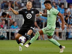 After coming off the bench, Teemu Pukki, left, battled with Austin FC defender Julio Cascante in Pukki’s debut for Minnesota United last Saturday at