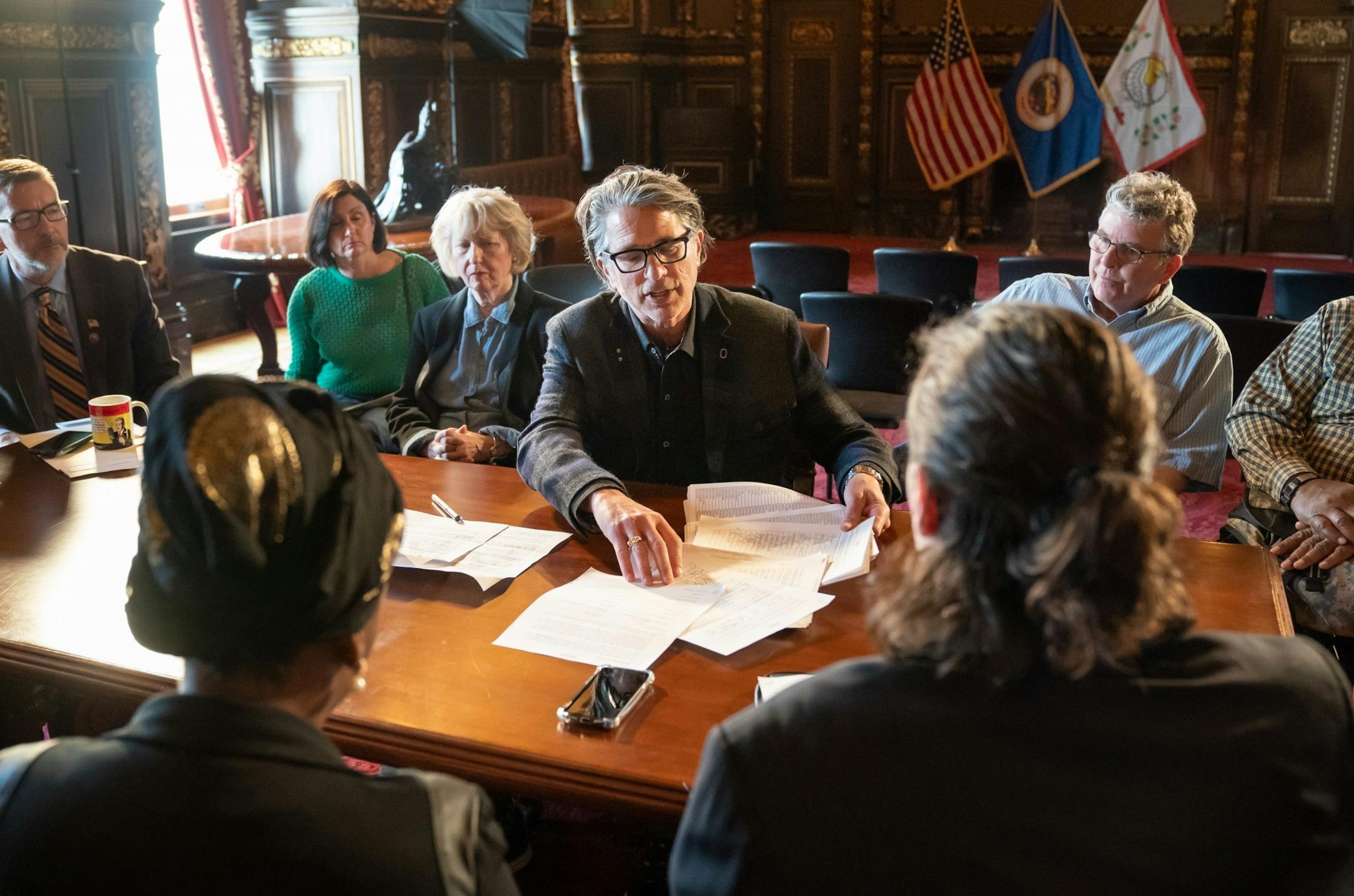 Sturt Chazin anbd Mary Pattock represented a group of residents from the Kenwood neighborhood who presented Governor Walz staff with a petition calling for the Met Council to hold off on cutting trees in the Kenilworth Corridor for Southwest light rail until federal funding is secured.