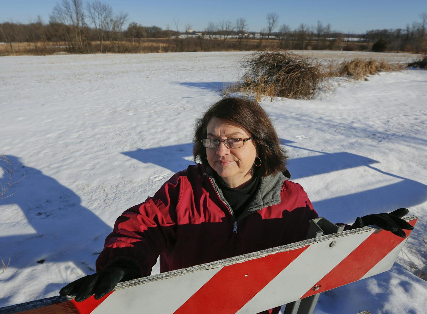 Scott County Commissioner Barbara Marschall with the disputed land behind her.] BRIAN PETERSON &#x201a;&#xc4;&#xa2; brianp@startribune.com Shakopee, MN - 1/22/2015