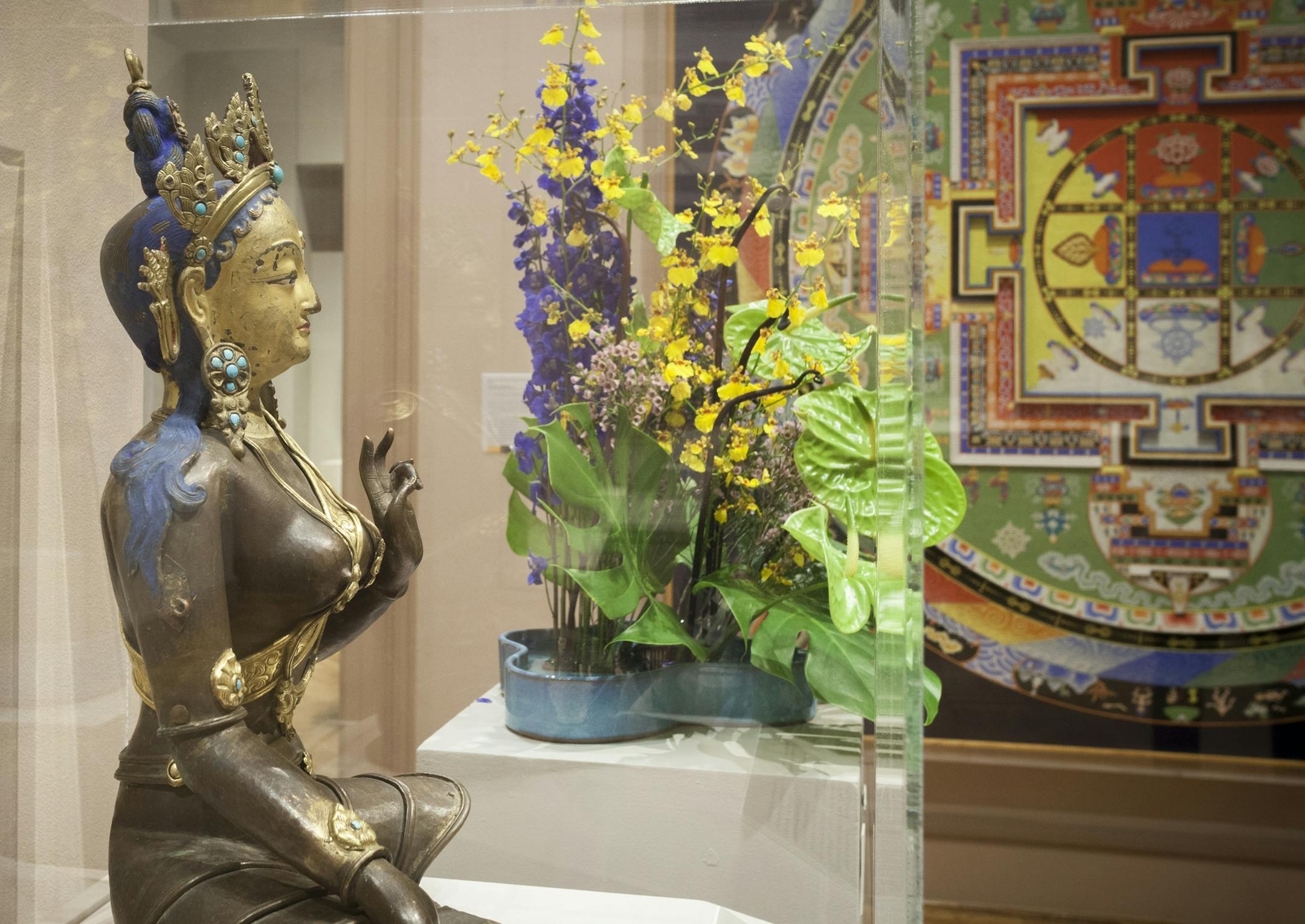 The arrangement in the Asian galleries is inspired by a bronze statue and the Yamantaka Mandala from last year's Art in Bloom. Provided by Minneapolis Institure of Art.