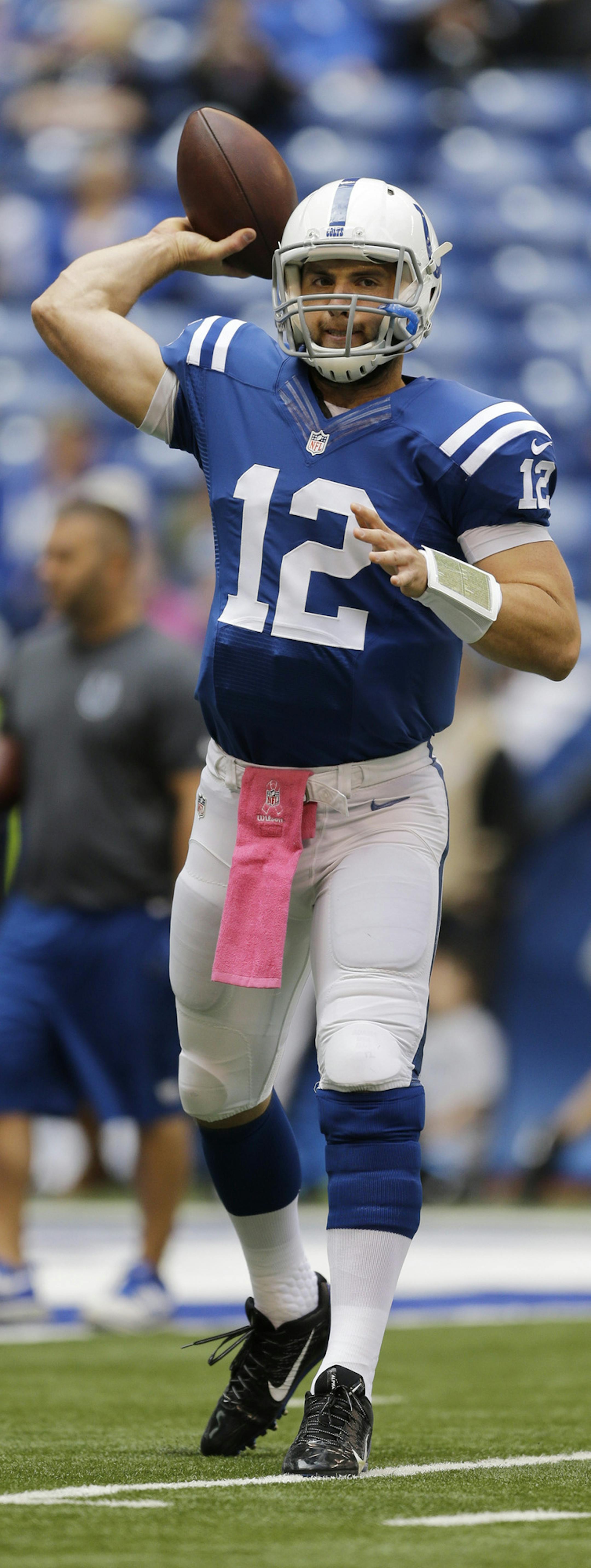 Indianapolis Colts quarterback Andrew Luck throws before an NFL football game between the Indianapolis Colts and the Baltimore Ravens in Indianapolis, Sunday, Oct. 5, 2014. (AP Photo/Jeff Roberson)