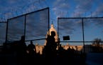A member of the National Guard closed a section of security fencing outside the Capitol in Washington, on Saturday, Jan. 16, 2021. Federal officials h