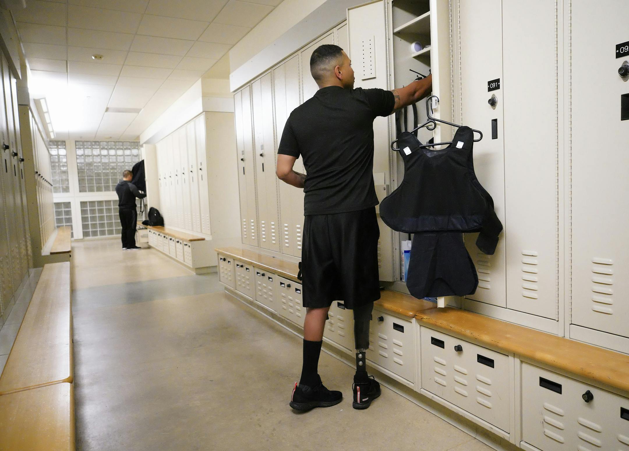 Christopher Lawrence arrives at CVPD at 5am in the morning to get dressed and to ready his patrol car before roll call. Christopher Lawrence a former Marine who served in Iraq was struck by an IED and eventually lost his leg. Since then he has been training and currently works as an officer with the Chula Vista Police Department. (Nelvin C. Cepeda/San Diego Union-Tribune/TNS) ORG XMIT: 1228705