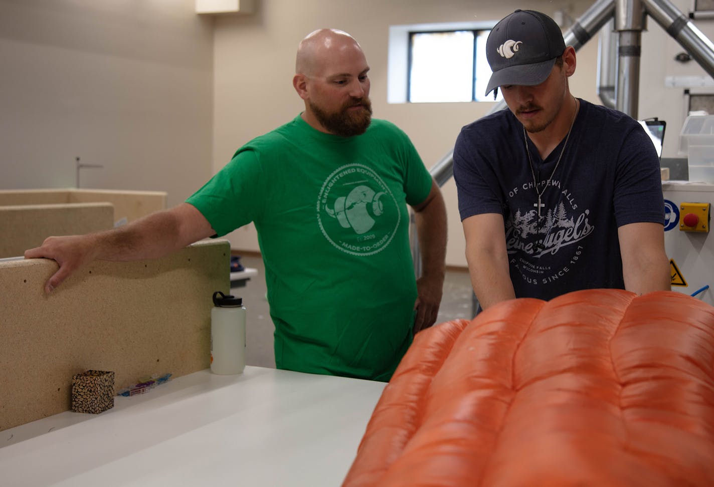 Tim Marshall, left, in the production facility in Winona. His ultralight camping quilts are a best-seller in the highly competitive outdoor gear industry.