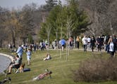 Hundreds of pedestrians and cyclists spent the afternoon at Bde Maka Ska Wednesday. ] aaron.lavinsky@startribune.com Minneapolis' parks have become a 