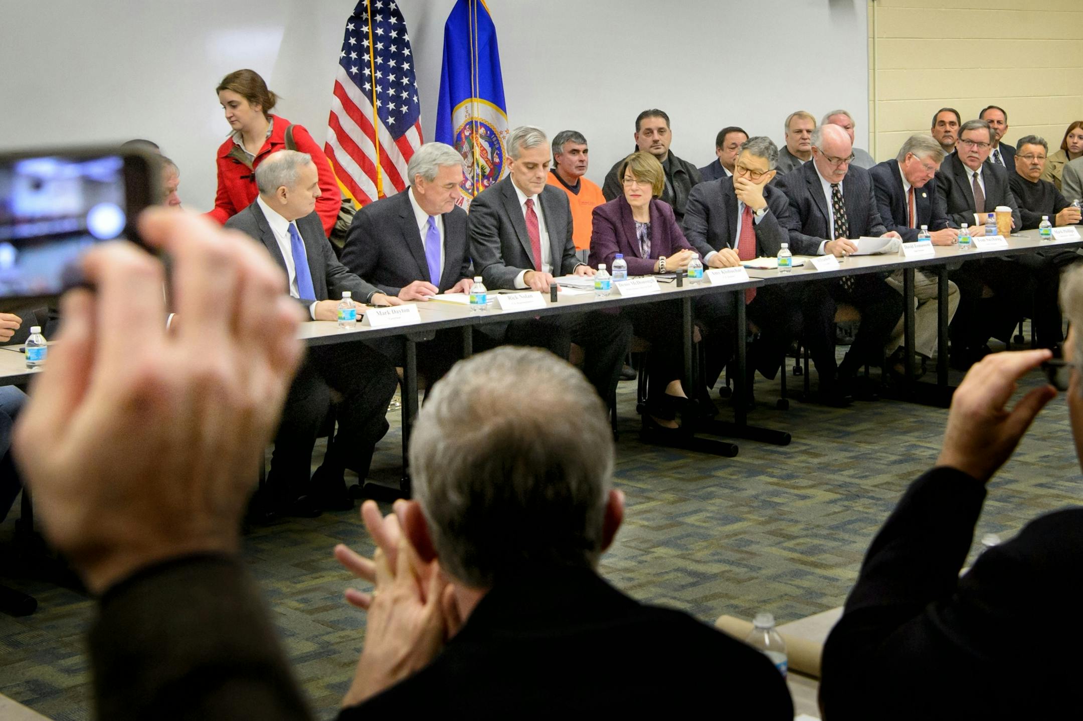 White House chief of staff Denis McDonough, center, talked with U.S. Rick Nolan at the start of the meeting. From the left are Governor Mark Dayton, Nolan, McDonough, Senators Amy Klobuchar and Al Franken.