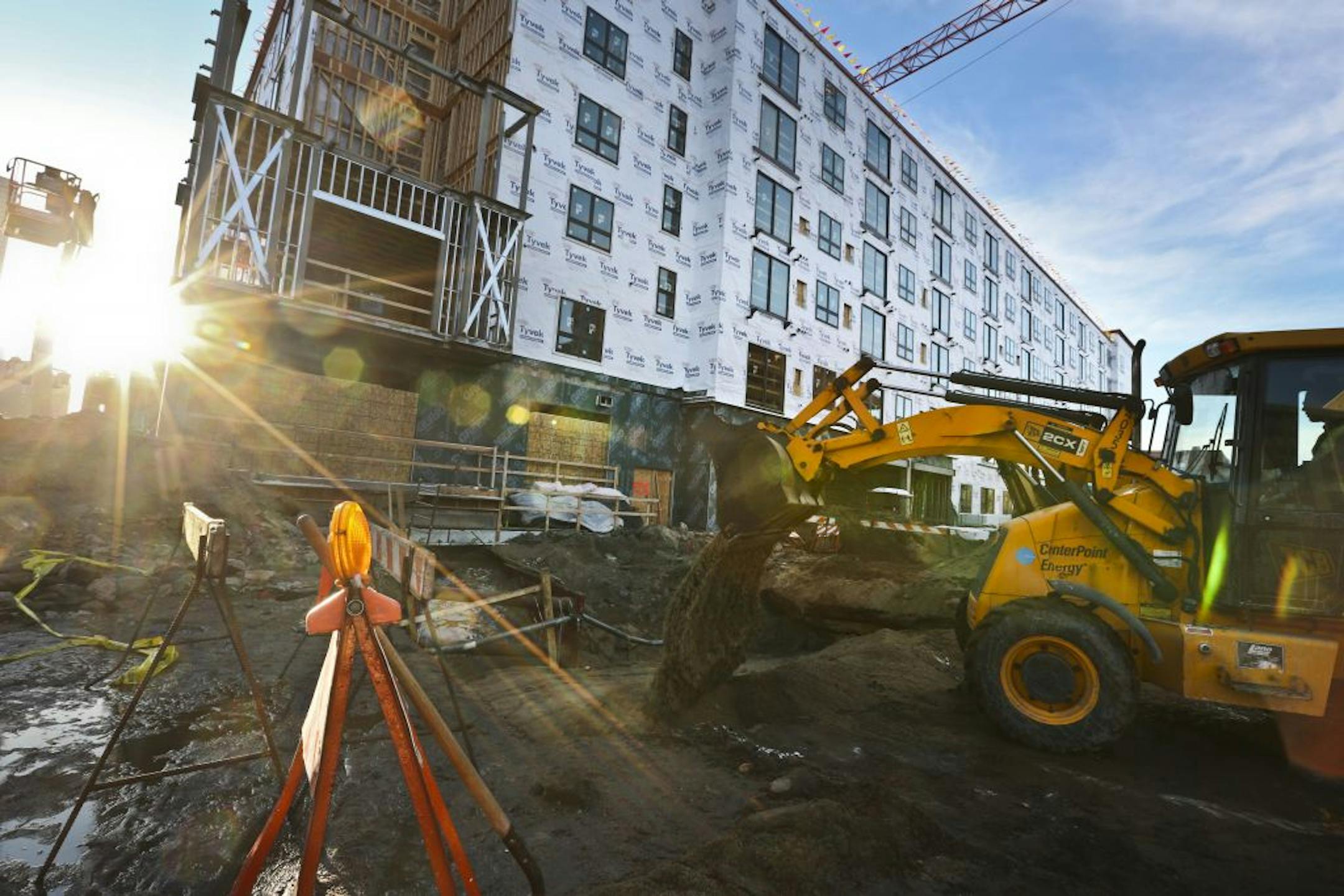 Crews worked Monday to fill the hole in the area of N. 2nd Street and Hennepin Avenue in Minneapolis where a water main broke late last week.