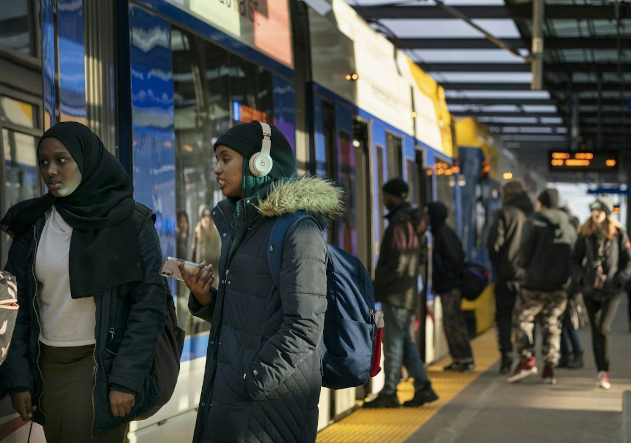 Light rail users boarded the train at the LRT Lake Street Station..
