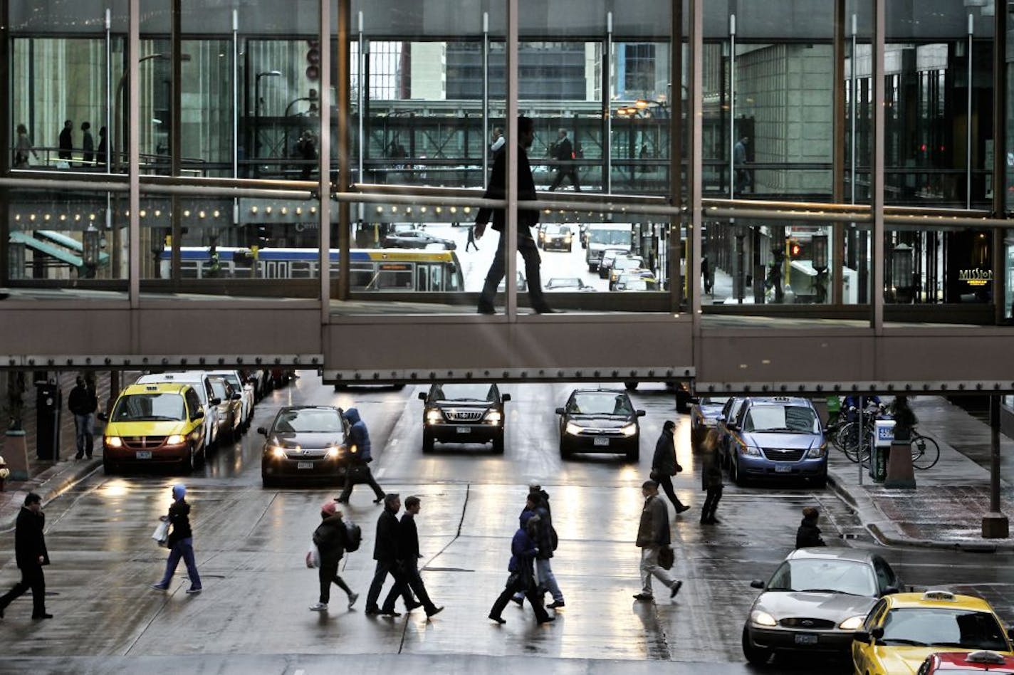 Pedestrians make their way along Nicollet Mall - some via skyways and some on the street.