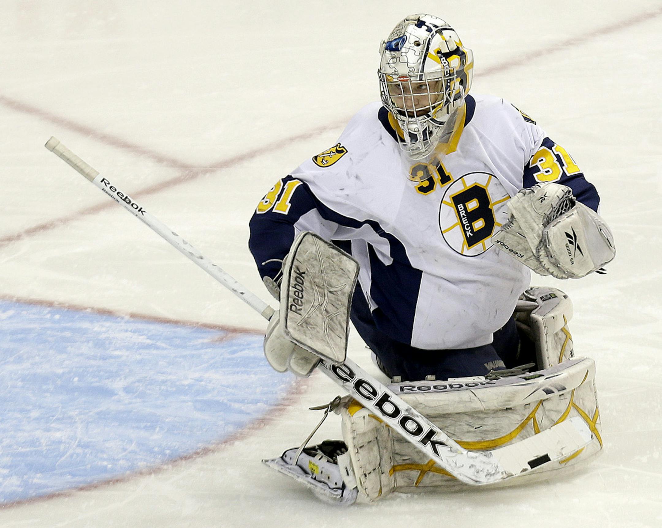 Breck's goalie Henry Johnson deflects a puck during the first period of the Class 1A boys' hockey state tournament quarterfinals at the Xcel Energy Center, Wednesday, March 6, 2013 in St. Paul, MN.(ELIZABETH FLORES/STAR TRIBUNE) ELIZABETH FLORES &#x2022; eflores@startribune.com