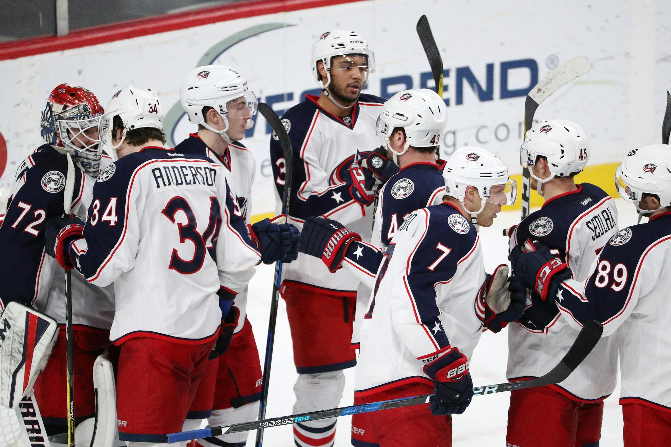 Columbus Blue Jackets players celebrated with goaltender Sergei Bobrovsky after defeating the Wild 4-2 on Dec. 31, 2016, to end Minnesota's 12-game winning streak and extend Columbus' streak to 15 games.
