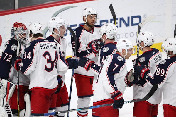 Columbus Blue Jackets players celebrated with goaltender Sergei Bobrovsky after defeating the Wild 4-2 on Dec. 31, 2016, to end Minnesota's 12-game wi