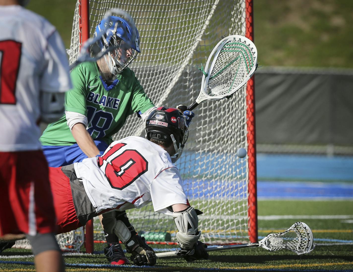 Lakeville North's Roman Rohrbach score on Blake goalie Nick Washuta in the second period at Minnetonka High School in Minnetonka, Minn., on Tuesday, June 9, 2015. ] RENEE JONES SCHNEIDER &#x2022; reneejones@startribune.com Lakeville North verses The Blake School in the Lacrosse quarterfinals match.