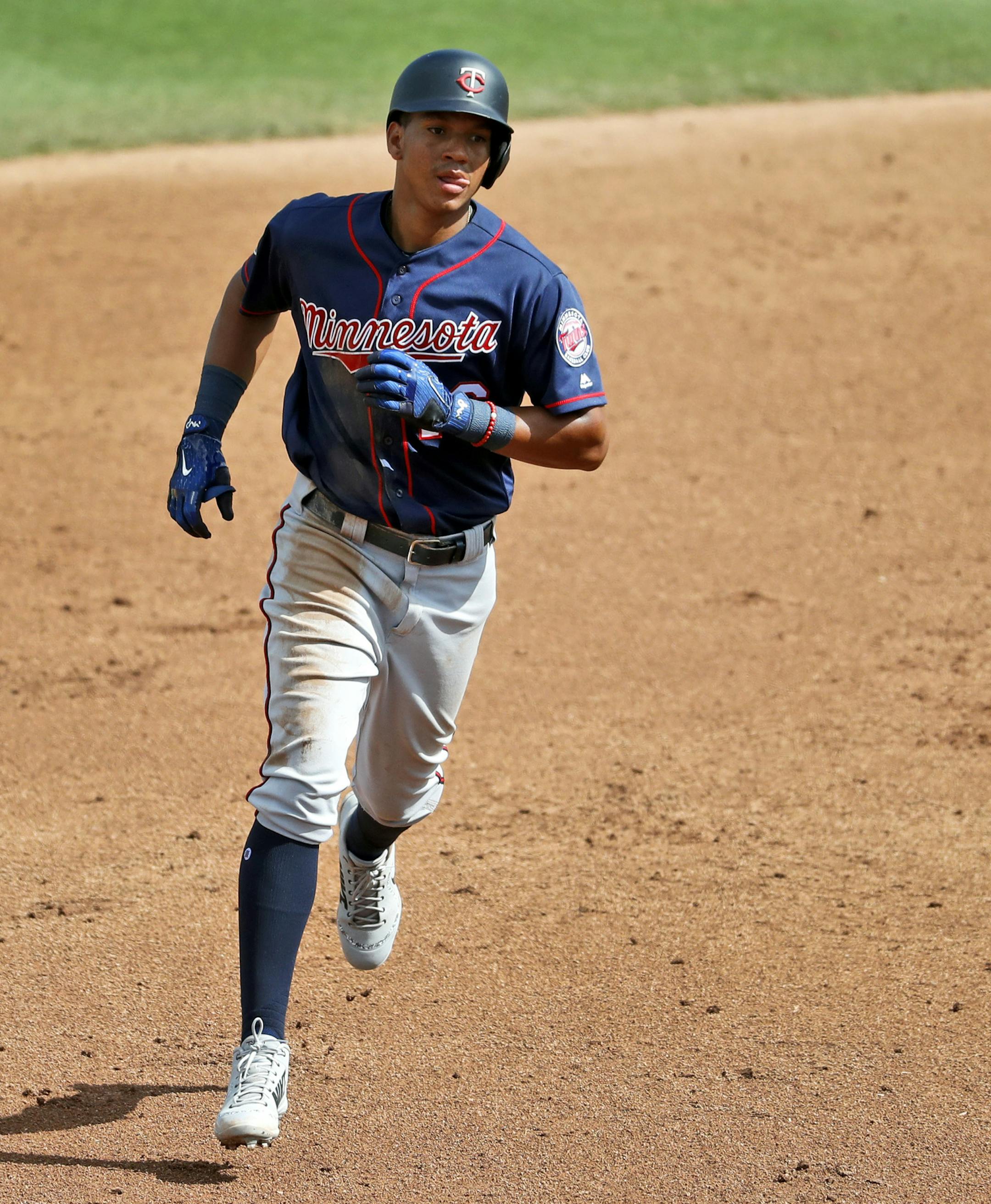 Minnesota Twins' Ehire Adrianza rounds the bases after hitting a two-run home run during the fifth inning of an exhibition spring training baseball game against the St. Louis Cardinals, Thursday, March 1, 2018, in Jupiter, Fla. (AP Photo/Jeff Roberson)
