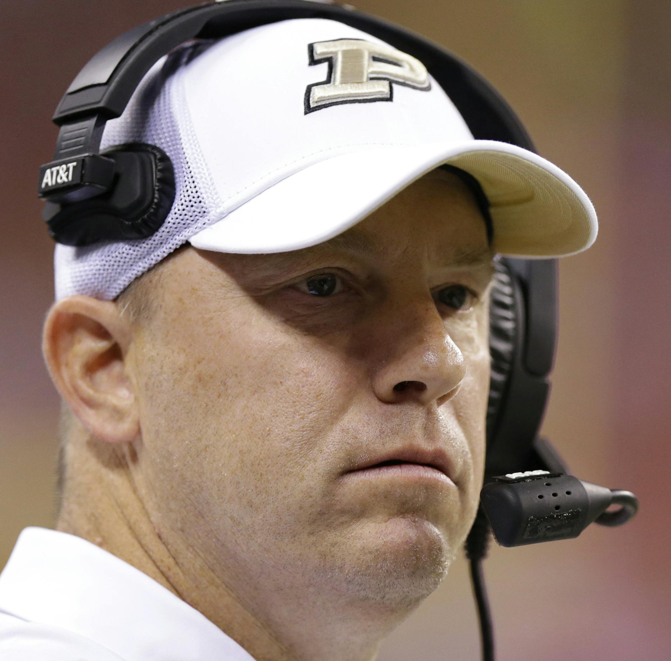 FILE - At left is a 2017 file photo showing Purdue NCAA college football coach Jeff Brohm. At right is a 2016 file photo showing Missouri coach Barry Odom. The Boilermakers take to the road for the first time against Missouri, Purdueís first game against a Southeastern Conference foe since 2004. (AP Photo/File)