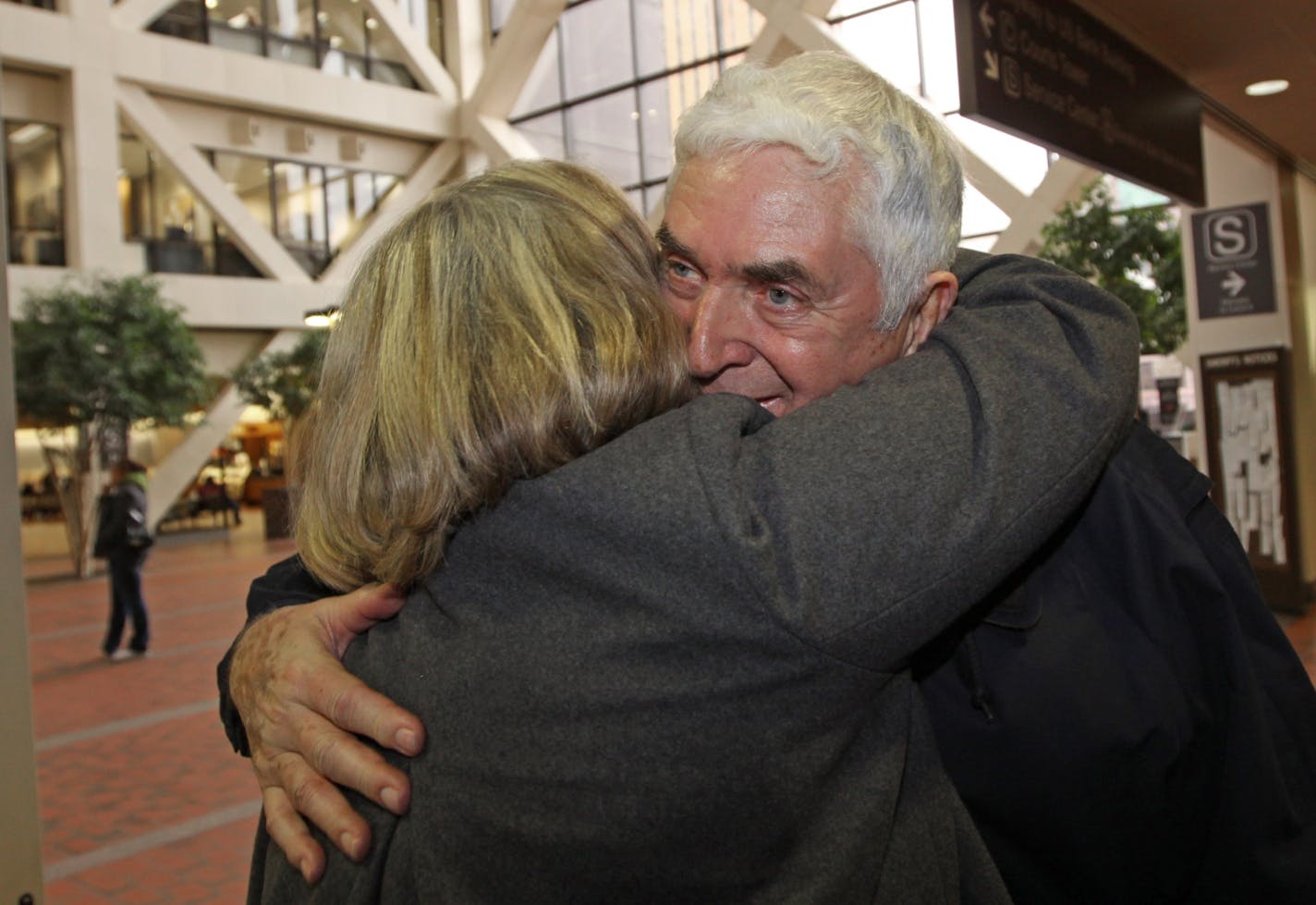 Carol Egyhazi of Chanhassen, who was just passing by, gave Walter McNeil, known as Wally the Beerman, a hug Tuesday in celebration of his acquittal.