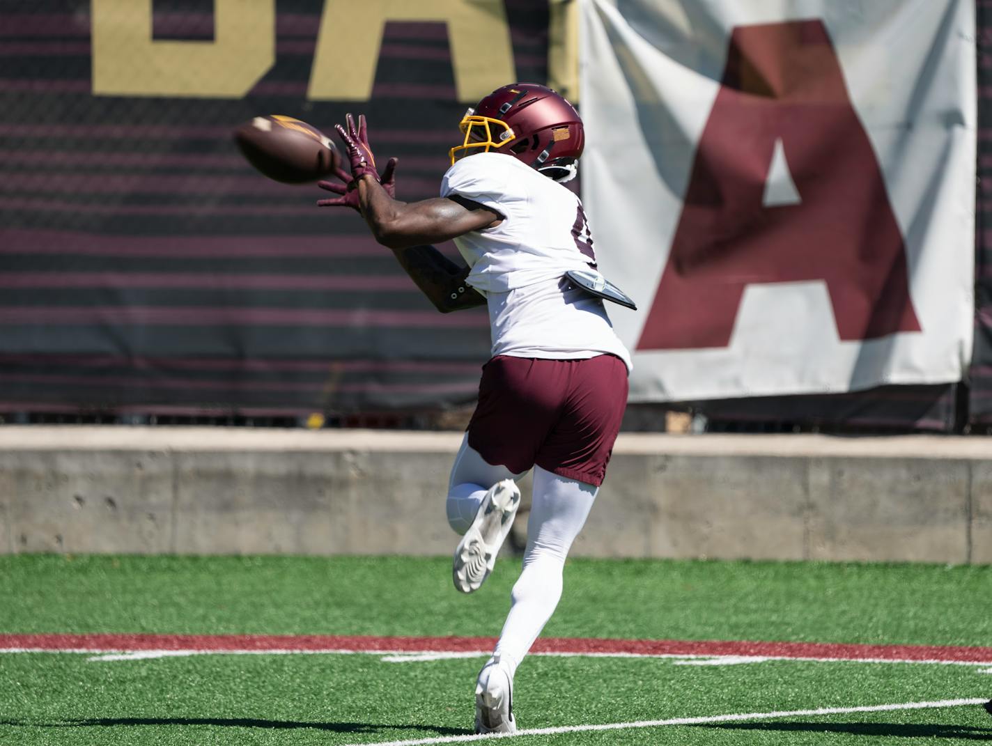 Wide receiver Corey Crooms (4) catches the ball during an open Gophers football practice at the Universtiy of Minnesota Tuesday, Aug. 15, 2023 in Minneapolis, Minn. ] RENEE JONES SCHNEIDER • renee.jones@startribune.com