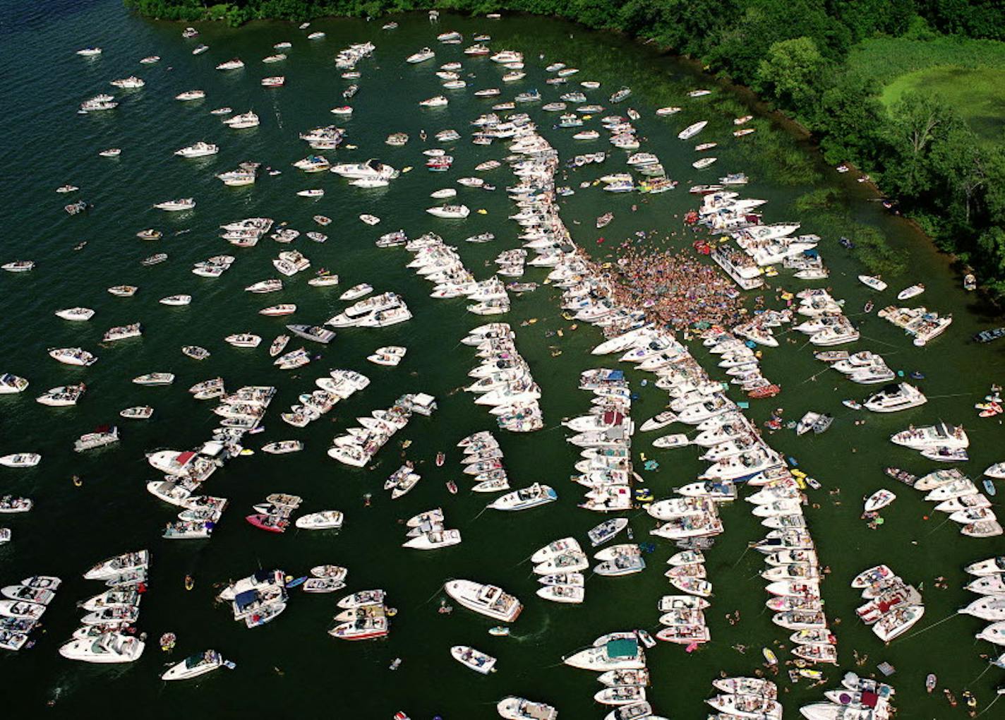 Lake Minnetonka has long been a popular spot for summer boaters, who often congregate in Cruiser&#x2019;s Cove, above.