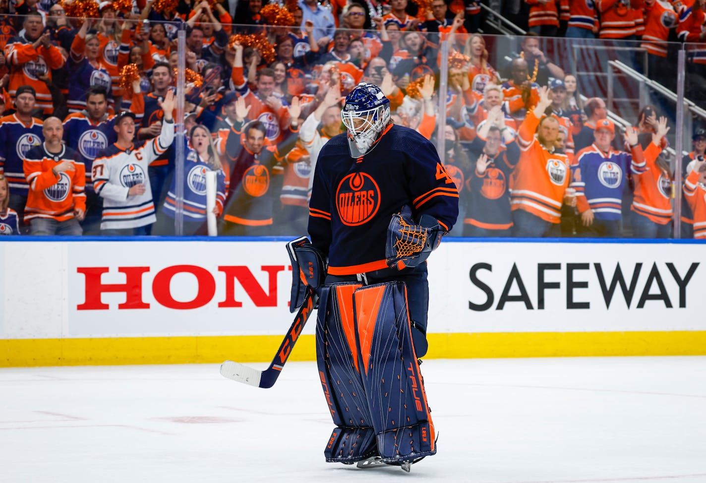 Edmonton Oilers goalie Mike Smith returns to the ice during third period NHL second round playoff hockey action against the Calgary Flames in Edmonton, Alberta, Sunday, May 22, 2022. (Jeff McIntosh/The Canadian Press via AP)