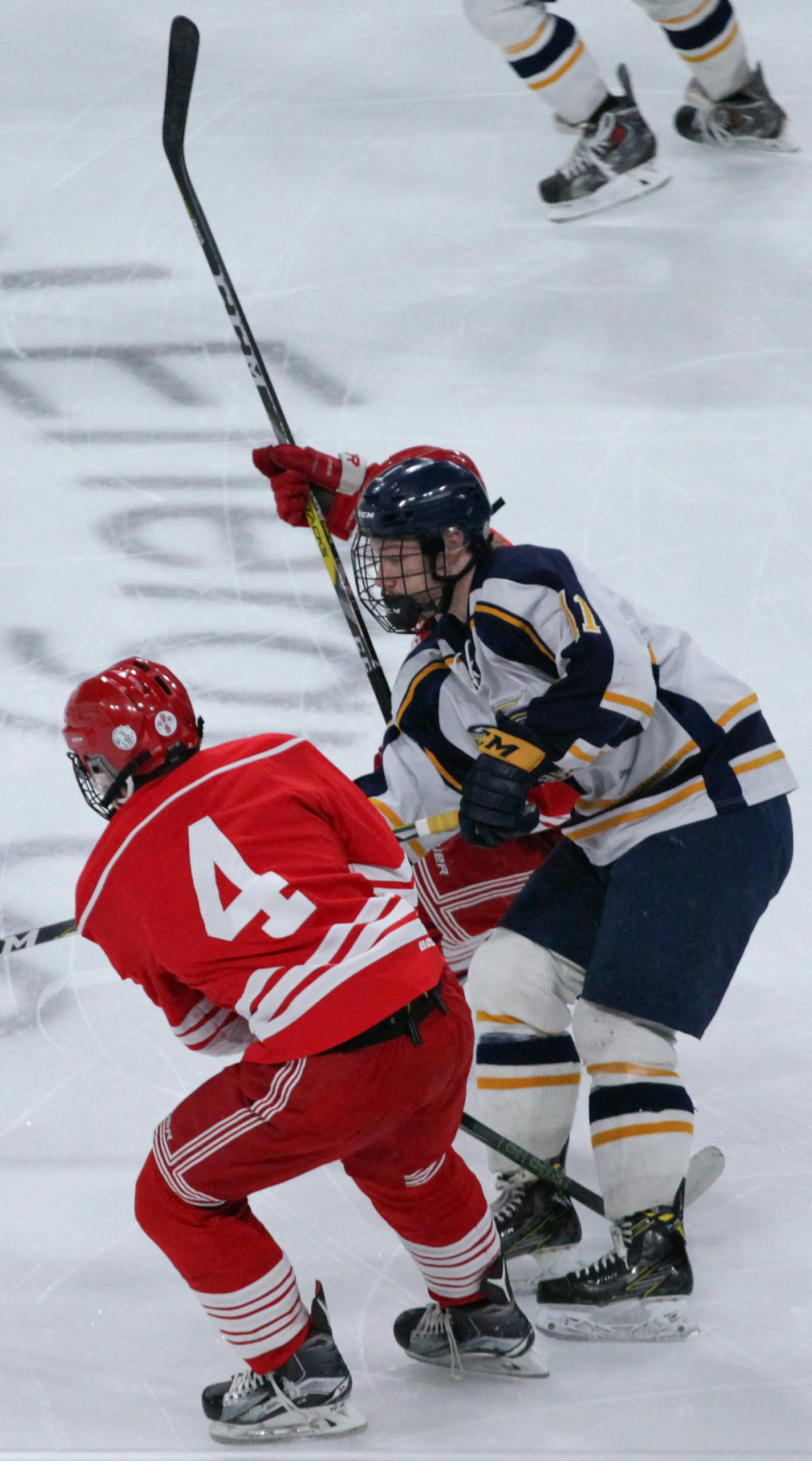 Luverne Declan Beers (4) and Hermantown Ryan Sandelin (11) chase the puck in the first period. ] XAVIER WANG &#x2022; xavier.wang@startribune.com Game action from a class A Boys&#x2019; Hockey state tournament between Luverne and Hermantown Wednesday. Mar, 8. 2017 at Xcel Energy Center in St. Paul, Minnesota.