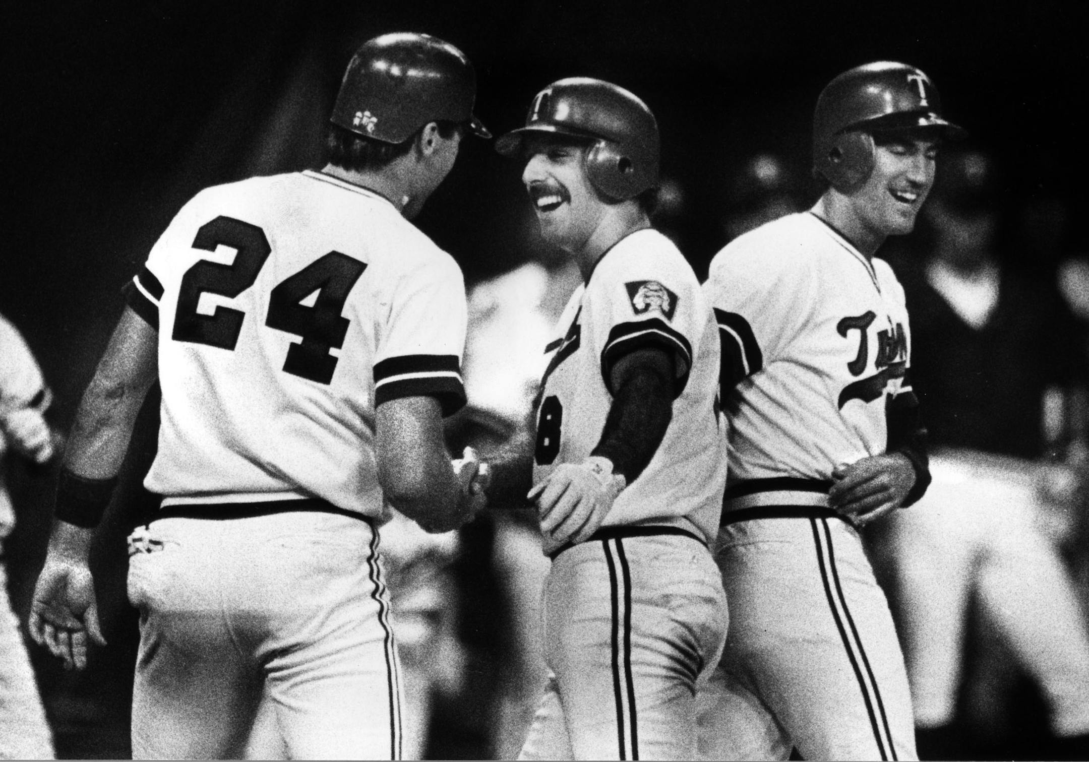 Gary Gaetti (at center) got the glad hand from Tom Brunansky (24) and Randy Bush (at right) after a three-run home run by Gaetti. Star Tribune photo July 30, 1984, by David Brewster. ORG XMIT: MIN2014030115000720