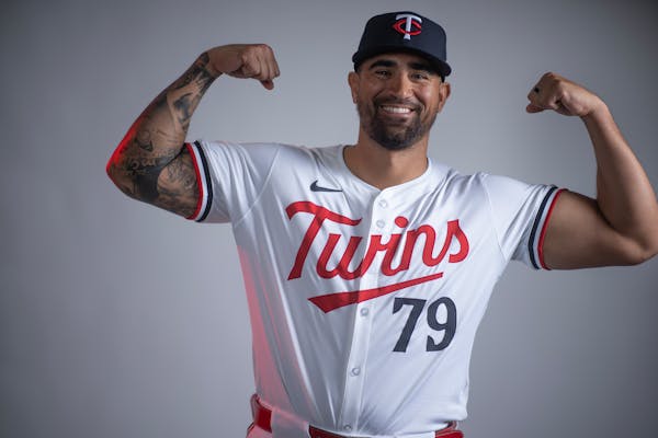Twins hitting coach David Popkins showed off some muscle during media day at spring training, before he had an idea for a rally sausage.
