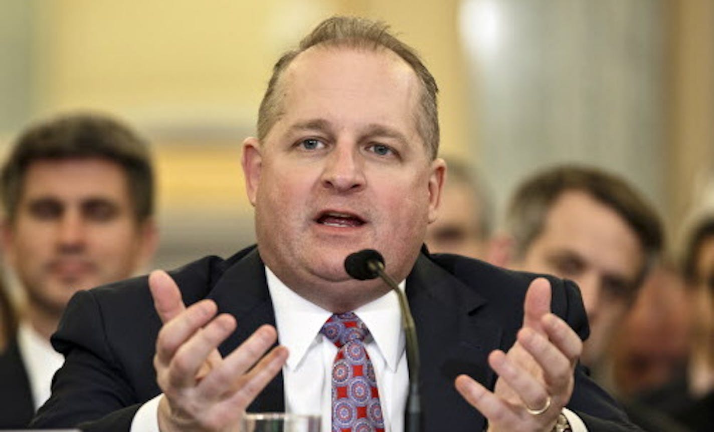 John J. Mulligan, Target Corporation&#xed;s chief financial officer and executive vice president, testifies before the Senate Commerce Committee about recent cyber attacks on Target retail stores and security breaches of consumers&#xed; financial information, at the Capitol in Washington, Wednesday, March 26, 2014. During the holiday shopping season, personal data from millions of Target customers was stolen by hackers who targeted credit card terminals in its stores. (AP Photo/J. Scott Applewhi