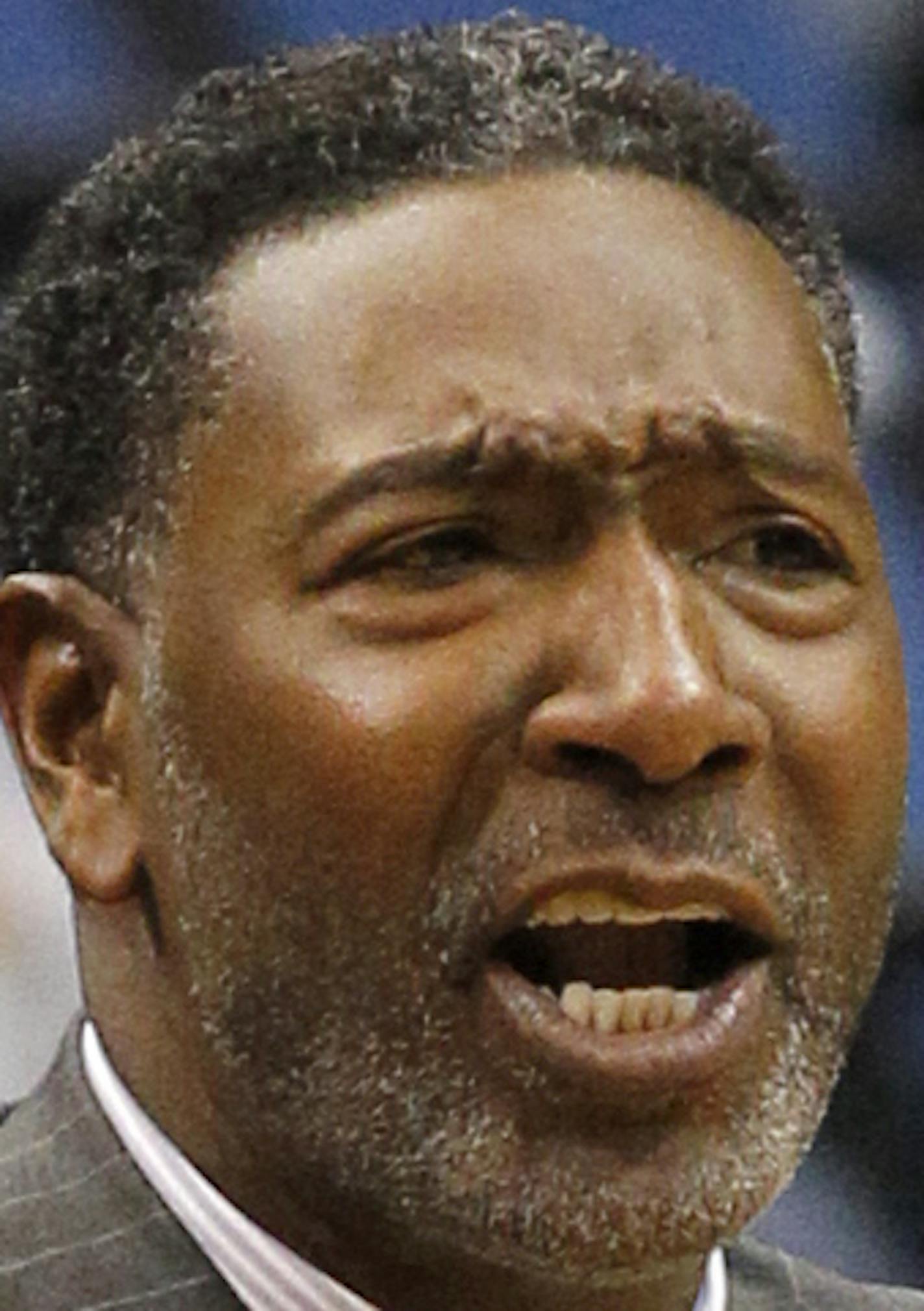 Minnesota Timberwolves assistant coach Sam Mitchell calls out to his players as he fills in for ill head coach Flip Saunders during the first quarter of an NBA basketball game against the Denver Nuggets in Minneapolis, Monday, Jan. 5, 2015. (AP Photo/Ann Heisenfelt) ORG XMIT: OTKAH103