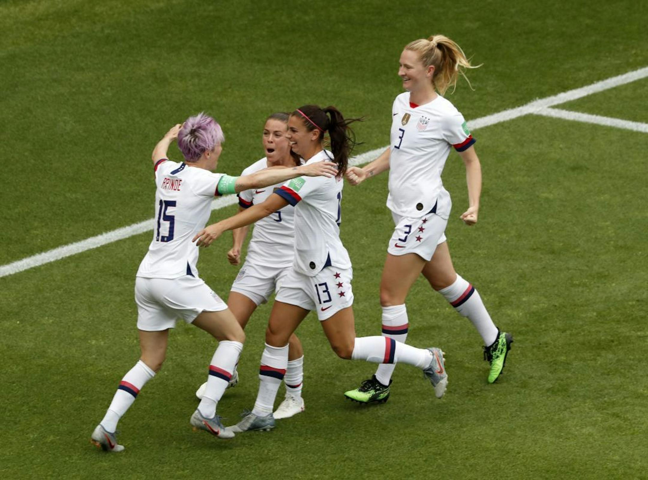 United States' Megan Rapinoe, left, celebrates with teammates after scoring her side's first goal from the penalty spot during the Women's World Cup round of 16 soccer match between Spain and United States at Stade Auguste-Delaune in Reims, France, Monday, June 24, 2019.