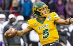 North Dakota State quarterback Trey Lance (5) winds up to throw during the first half of the FCS championship NCAA college football game against James