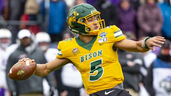 North Dakota State quarterback Trey Lance (5) winds up to throw during the first half of the FCS championship NCAA college football game against James