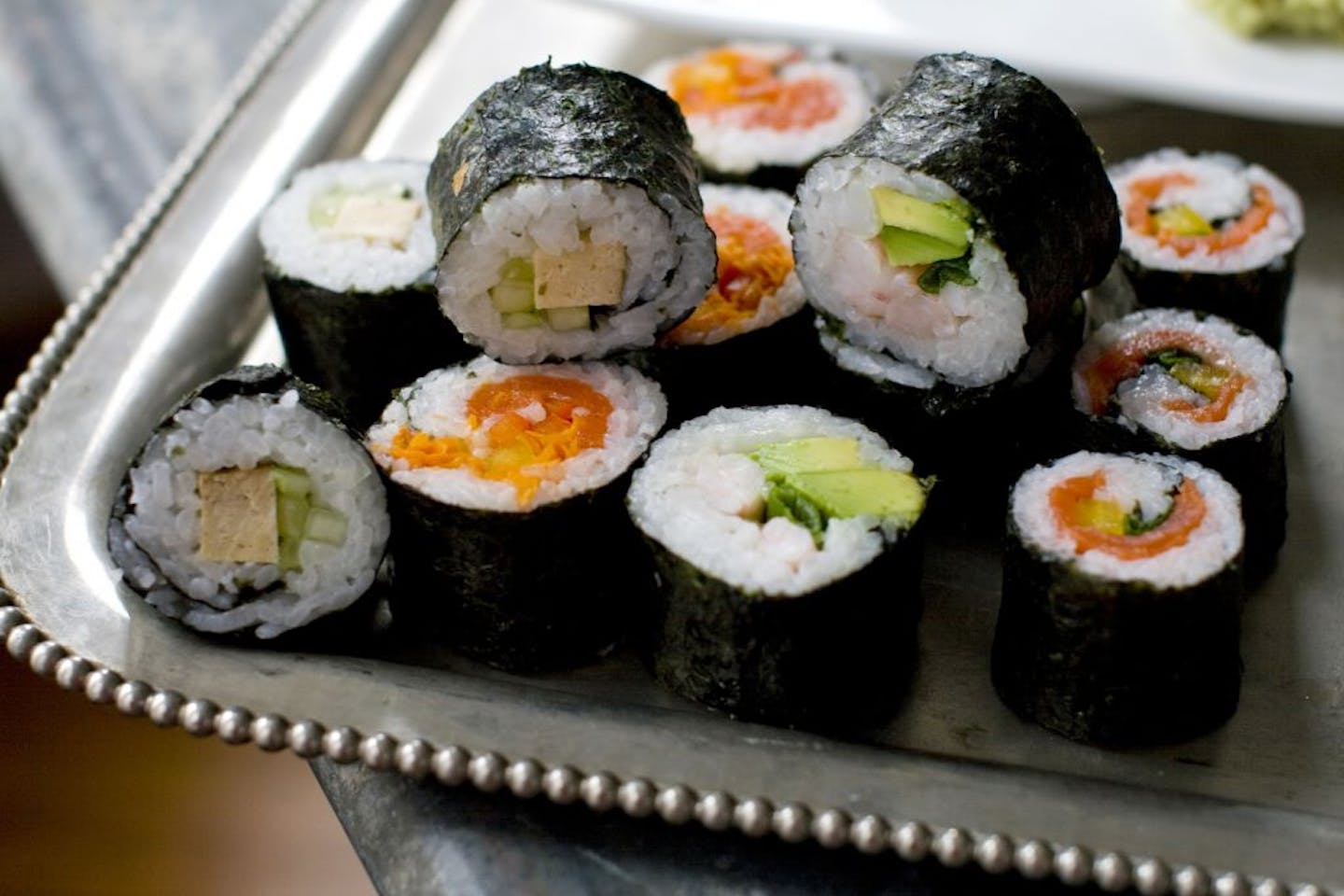 This Nov. 14, 2011 photo shows sushi rolls for a DIY sushi rolling party in Concord, N.H. There are many varieties of sushi, but the most appropriate for a party like this is the maki roll (also the variety Americans are most familiar with) _ sheets of nori seaweed wrapped around cooked sushi rice and a variety of fillings. These are easy to prepare and easy to personalize.